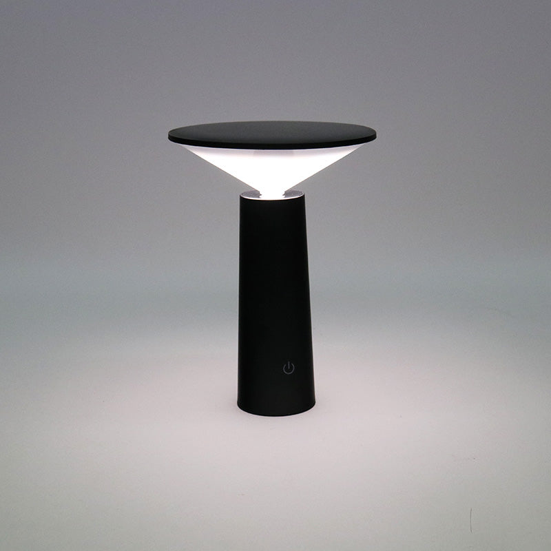 Black LED Tilt lamp lit with the shade angled to throw light forward