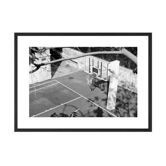 Black and white basketball hoop print in a black frame