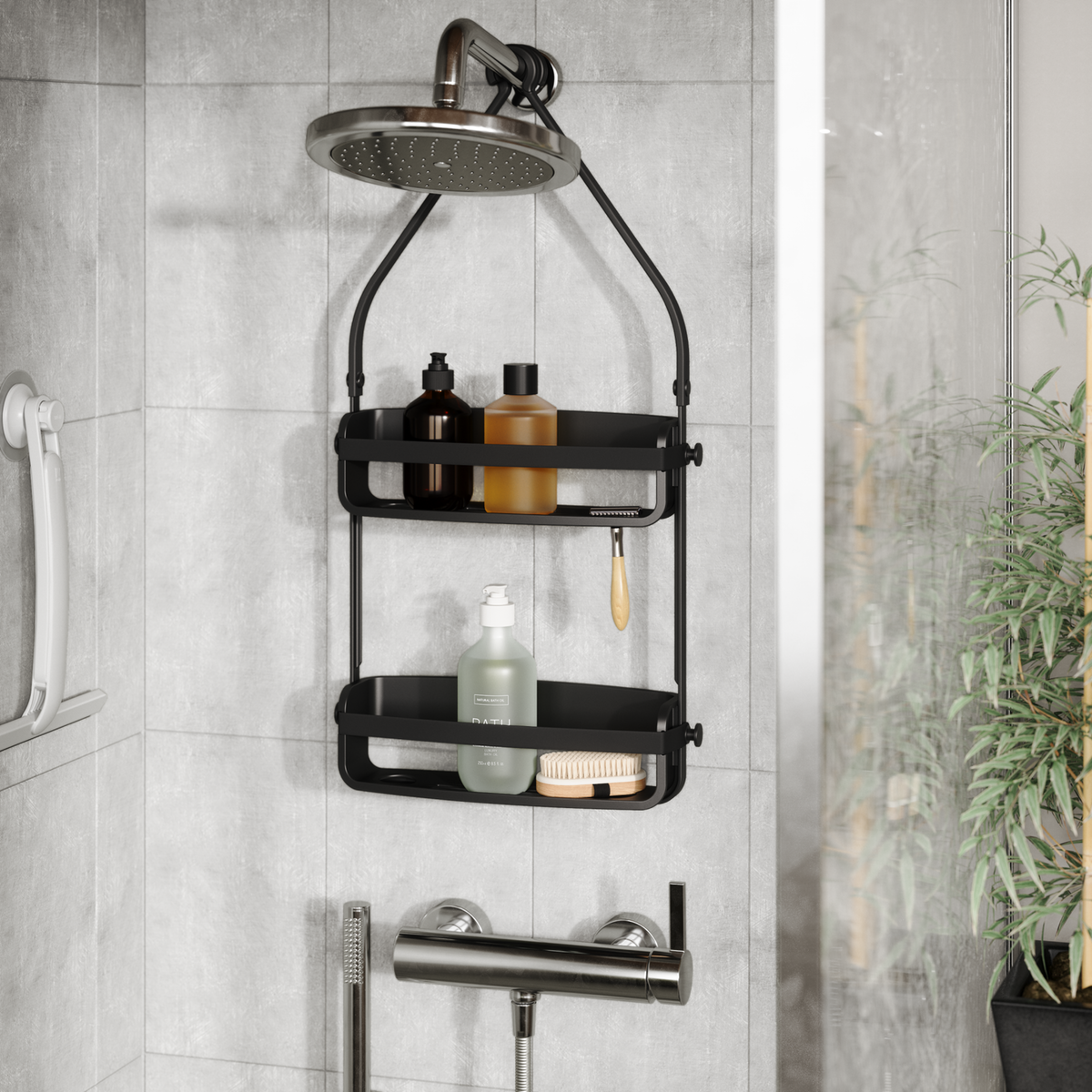 Umbra Flex shower caddy in black on a rain shower head in a tiled bathroom