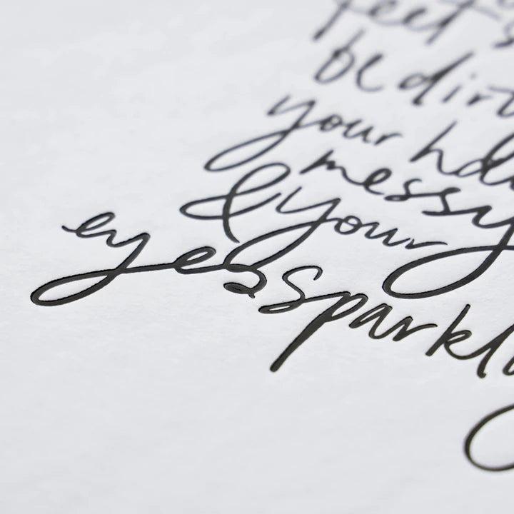 Close view of the handwritten quote ending in eyes sparkling