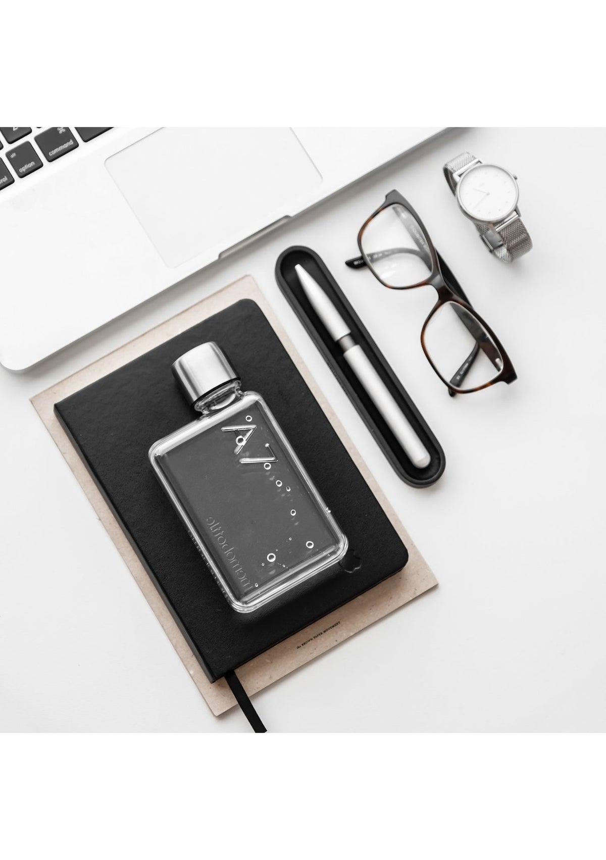 A compact A7 Memobottle by MemoBottle on a desk.