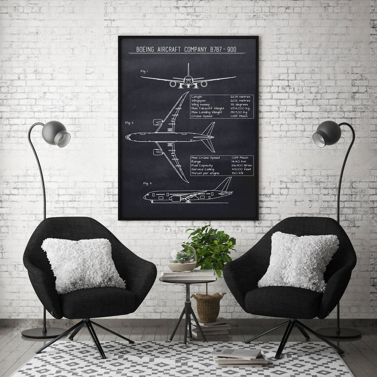 Boeing aircraft blueprint print in a black frame above two black armchairs against a white brick wall