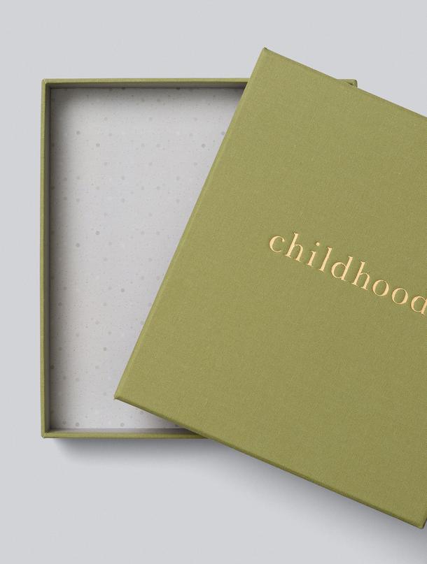 Childhood journal lifted from its open speckled keepsake box