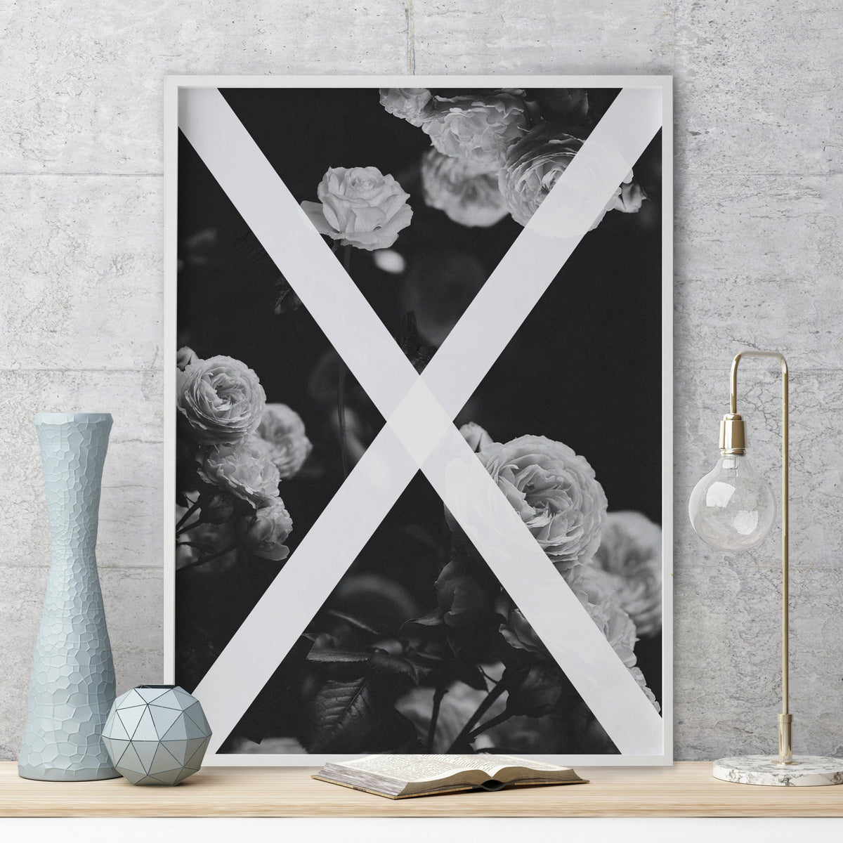 Alchemy print leaning on a timber shelf beside blue vases and a brass lamp