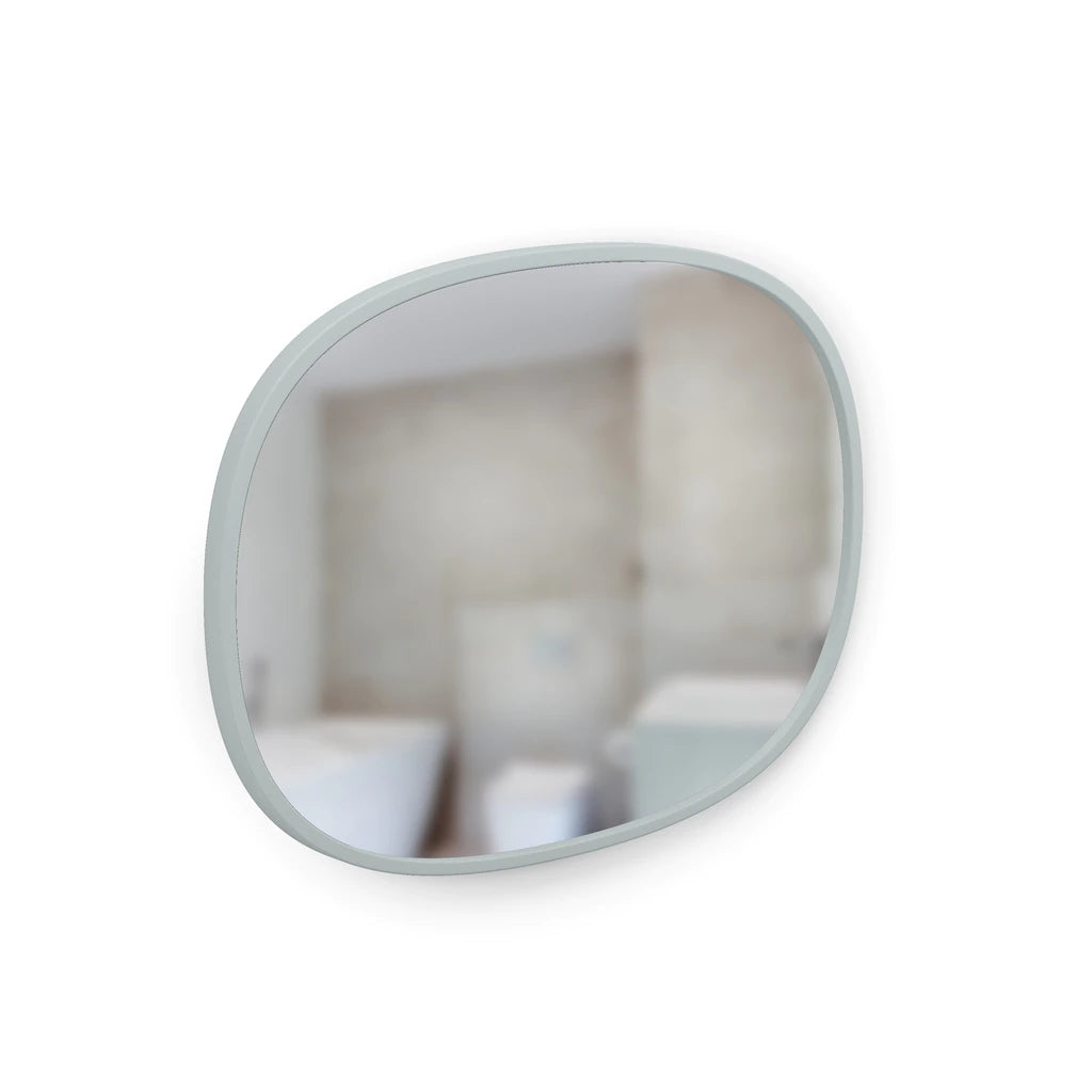 Grey Hub oval mirror hung landscape, reflecting a bathroom