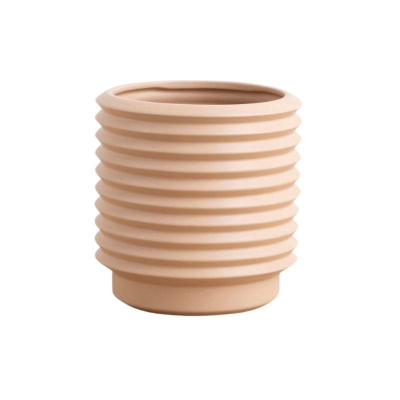 A Berlin Self Watering Planter - Nude with internal drainage saucer on a white background, by Potted