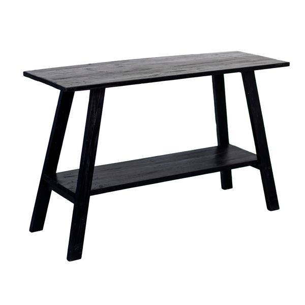 Three quarter view of the black teak console, showing the angled legs and shelf