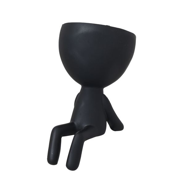 Black Egg Head shelf planter sitting empty with its legs hanging, on a white background