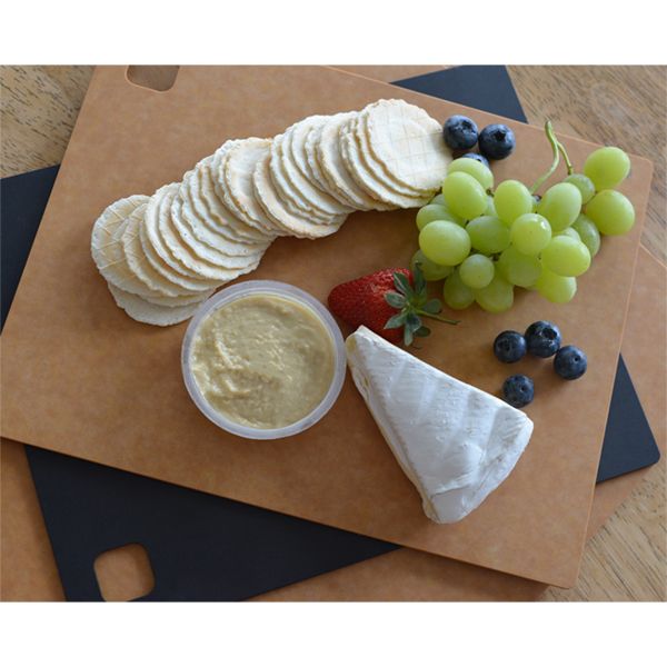 A Dishy cheese board with grapes and crackers on it.