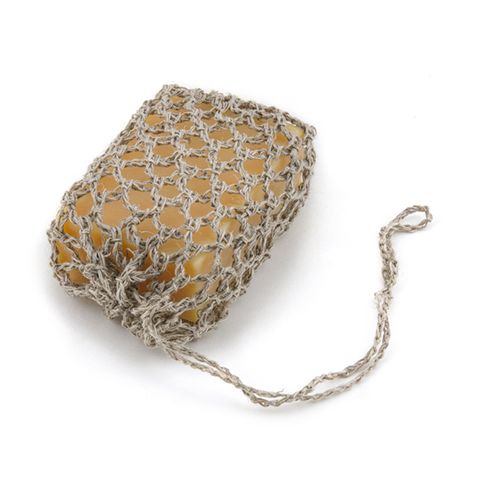 A Scandinavian-designed hemp soap saver with soap on a white background.