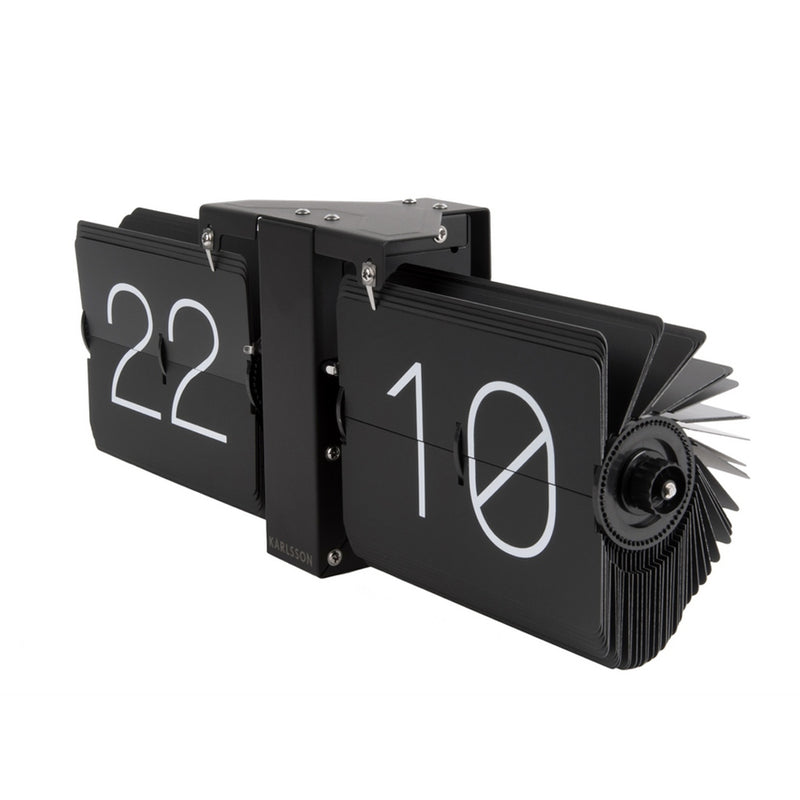 A Scandinavian Karlsson clock adorned with numbers.