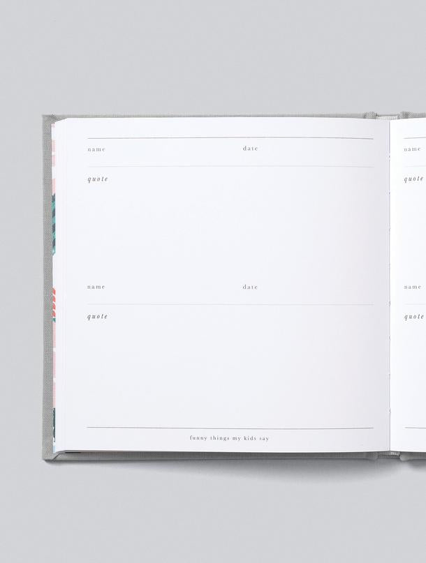An open book with a calendar and Funny Things My Kids Say GREY quotes by Write To Me.