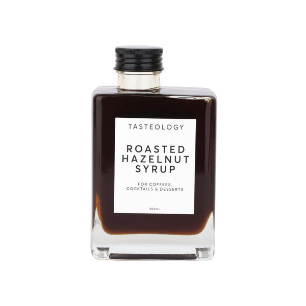A creamy bottle of Tasteology's Roasted Hazelnut Syrup, perfect for lattes.