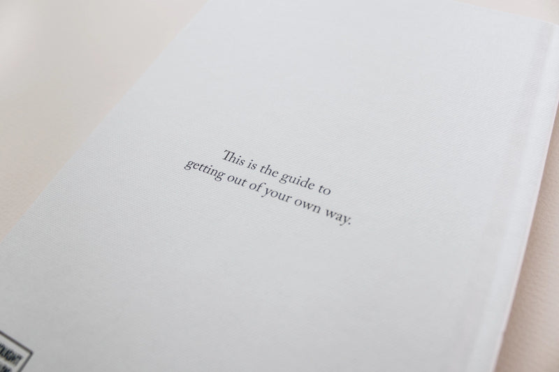 A white Morning Pages — Journal with a quote on it by Thought Catalog.