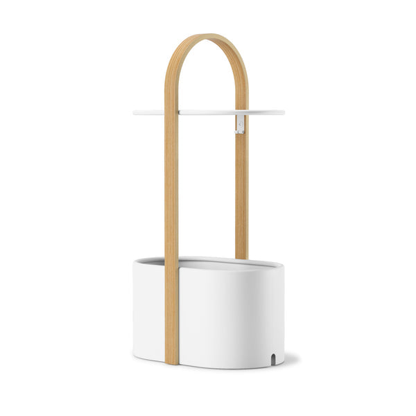 Umbra Bellwood storage table in white and natural, front view of the handle and tabletop
