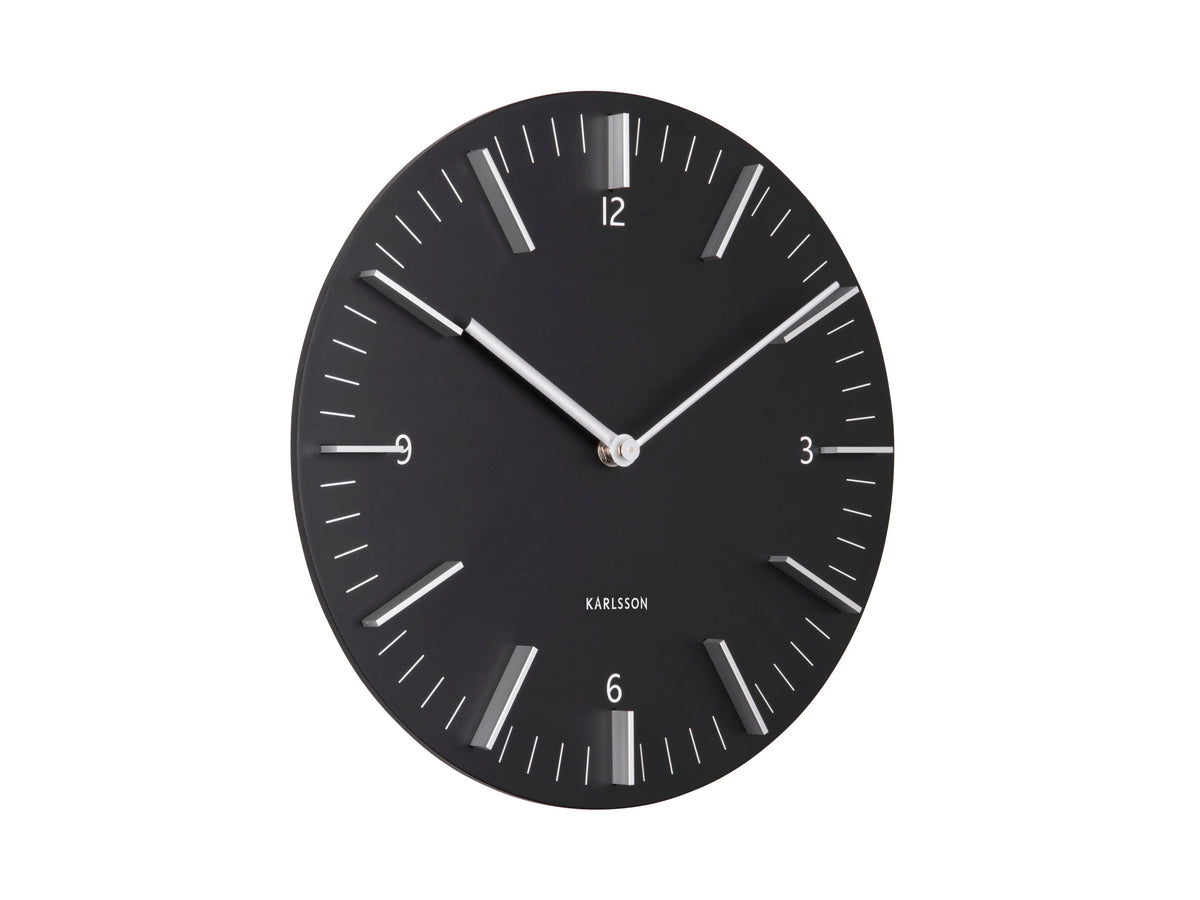 Detailed wall clock in black, angled view