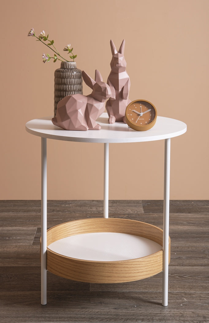 A modern classic white table with two rabbits, featuring a Karlsson Tinge Alarm Clock.