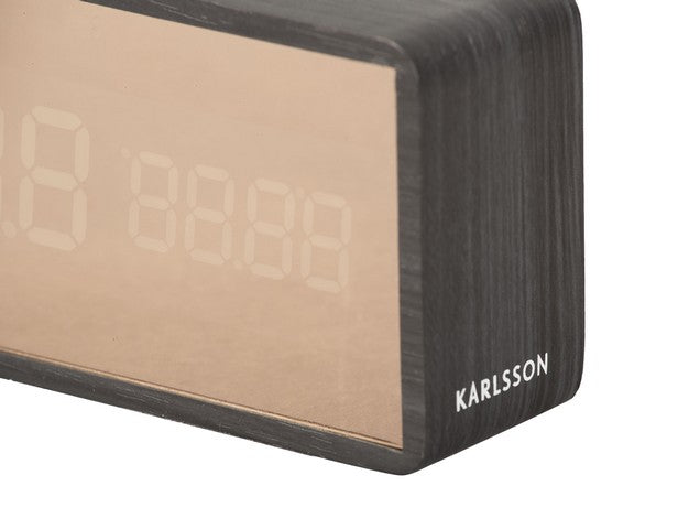 A Karlsson Alarm Mirror LED - Various Options clock with the word kallson on it.