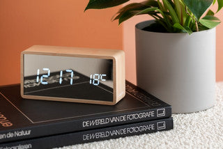 An innovative Dutch clock brand featuring Karlsson wooden alarm clocks.