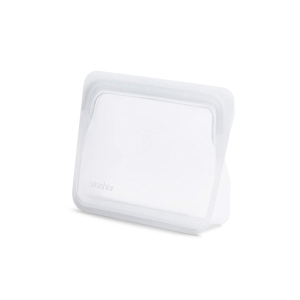 A Stasher STAND UP MINI-CLEAR plastic container on a white surface.