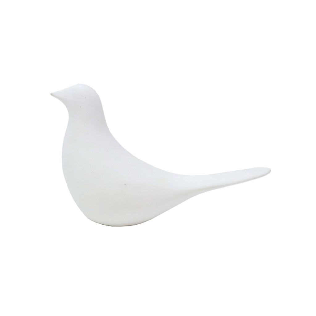 Matte white ceramic bird figurine with a long tapered tail, shown in profile on a white background