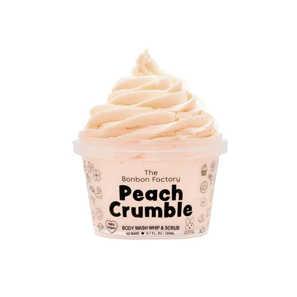 A cup of PEACH CRUMBLE BODY WASH WHIP by The Bonbon Factory on a white background featuring the succulent fruit.