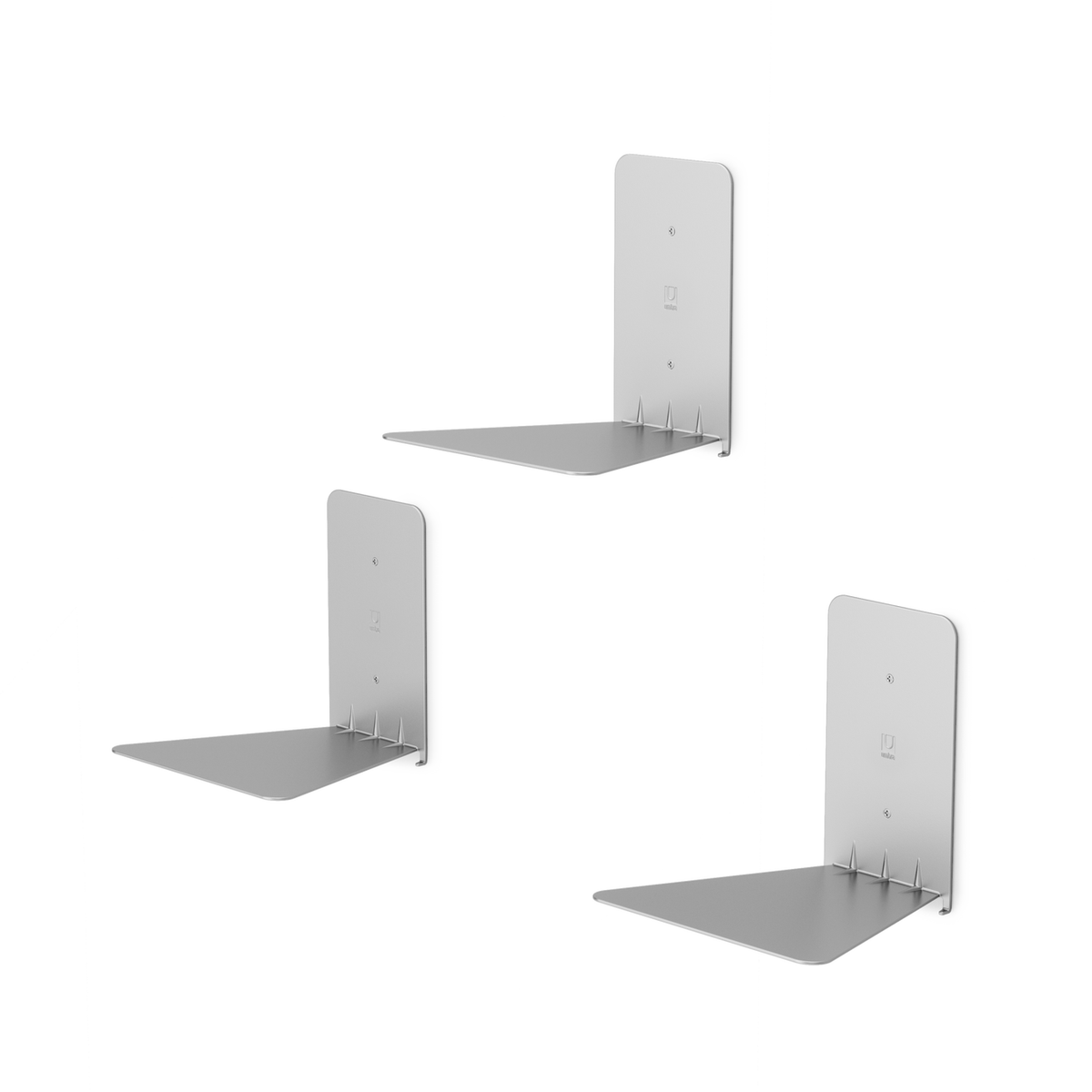 Three empty silver Umbra Conceal shelf brackets on white