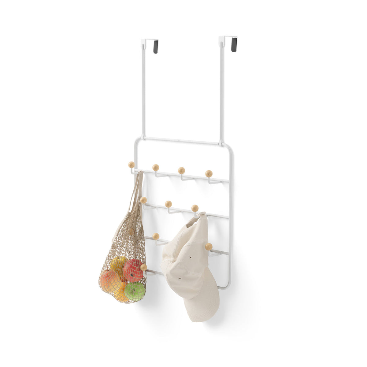 Umbra Estique organiser in white over a door holding a produce bag and a tote