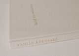 An Olive + Page - Hold The Moments Journal, a family keepsake book.