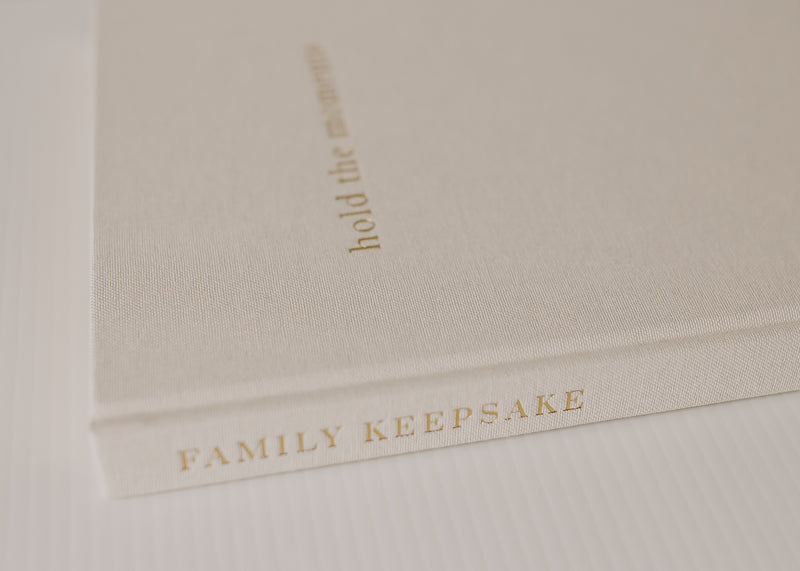 An Olive + Page - Hold The Moments Journal, a family keepsake book.