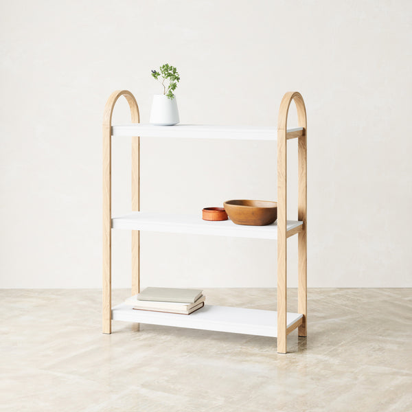 Umbra Bellwood freestanding three tier shelf in white and natural with books