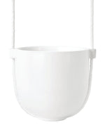 A Bolo Planter - Black hanging from a rope on a white background, resembling an Umbra.