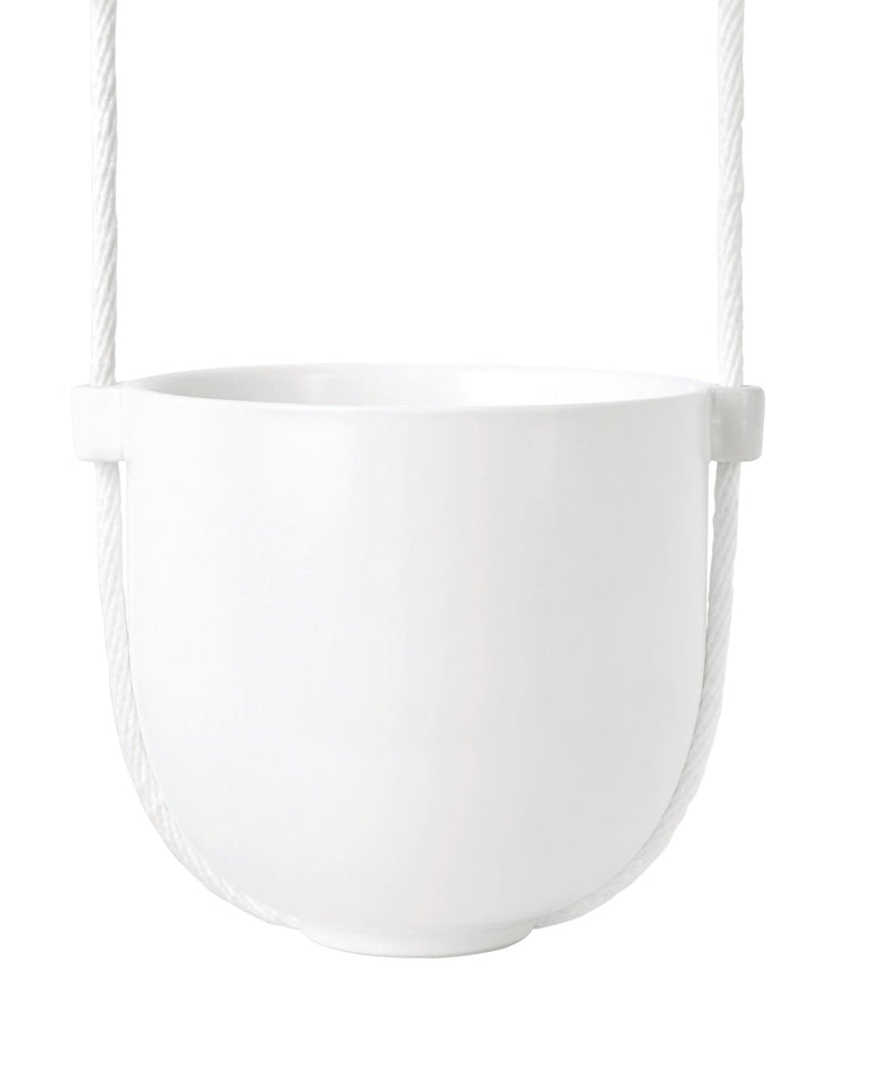A BOLO PLANTER - White by Umbra, in the form of a white bowl hanging from a rope, serves as beautiful wall decor against a white background.