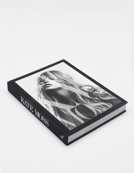 A black and white KATE: THE KATE MOSS BOOK with a woman's face on it.