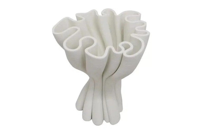 White Cooper 3D printed porcelain vase on a plain background, showing the twisted ruffled form
