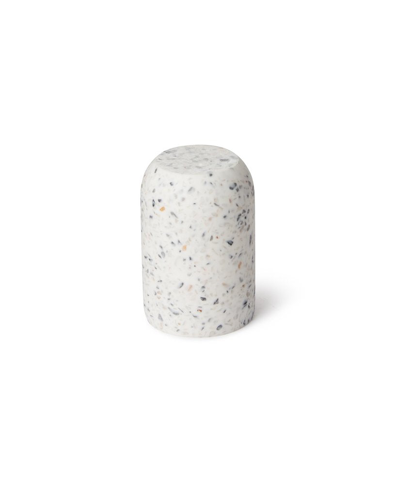 Umbra Junip terrazzo tumbler seen at an angle, speckled grey finish