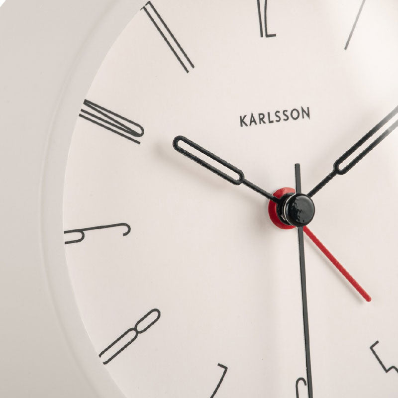 Close-up of the White Belle alarm clock dial with baton markers