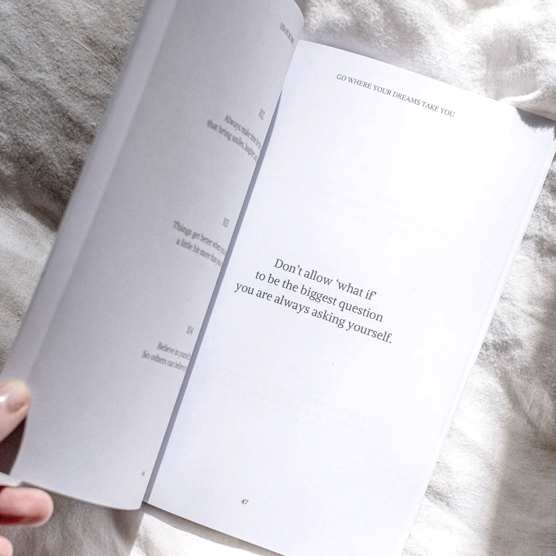The book open on bedding showing one of the printed reminders