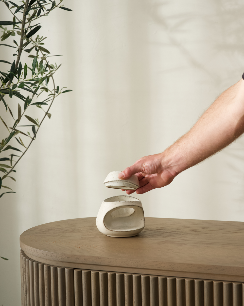 Fort Ceramic Wax Burner styled on a coffee table with books
