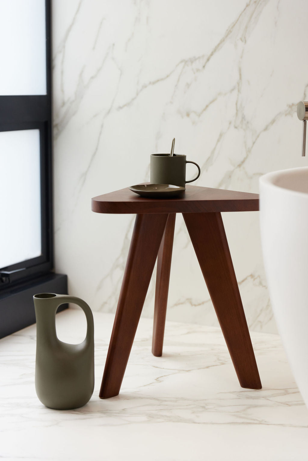 KHW Side Table close-up showing the sculptural curves