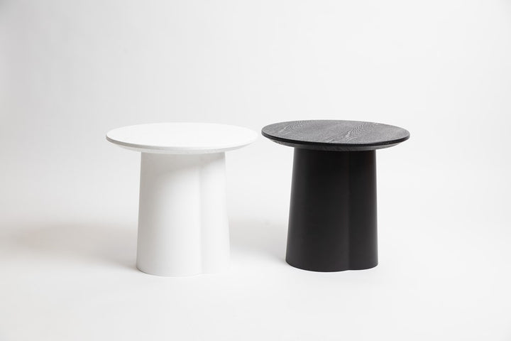 Strato Side Table in black styled beside an armchair