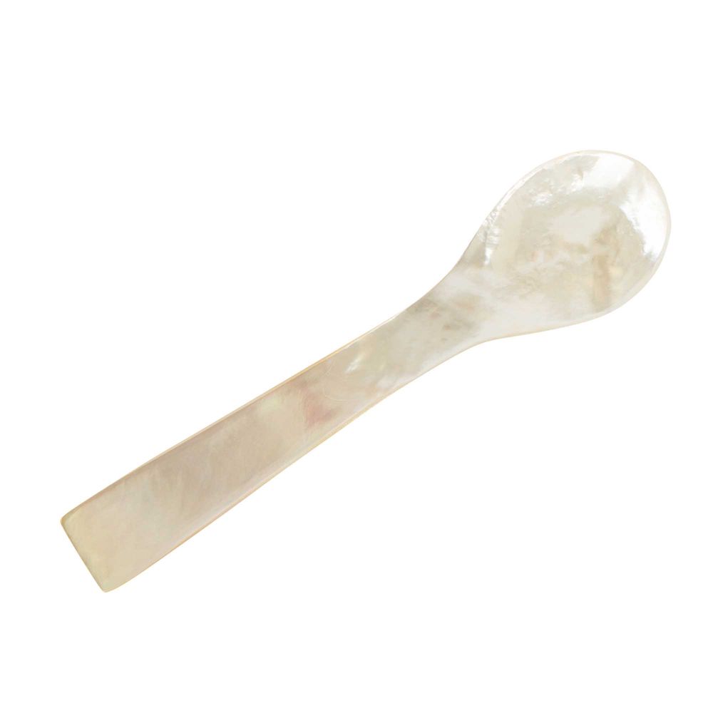 Mother of pearl spoon with a smooth oval bowl, on white