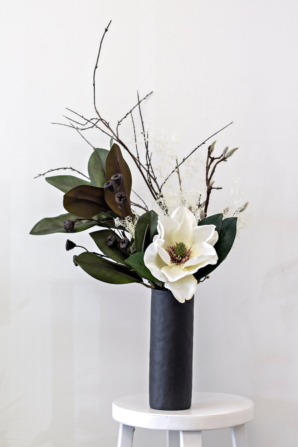 Bernie Vase styled with dried branches on a console