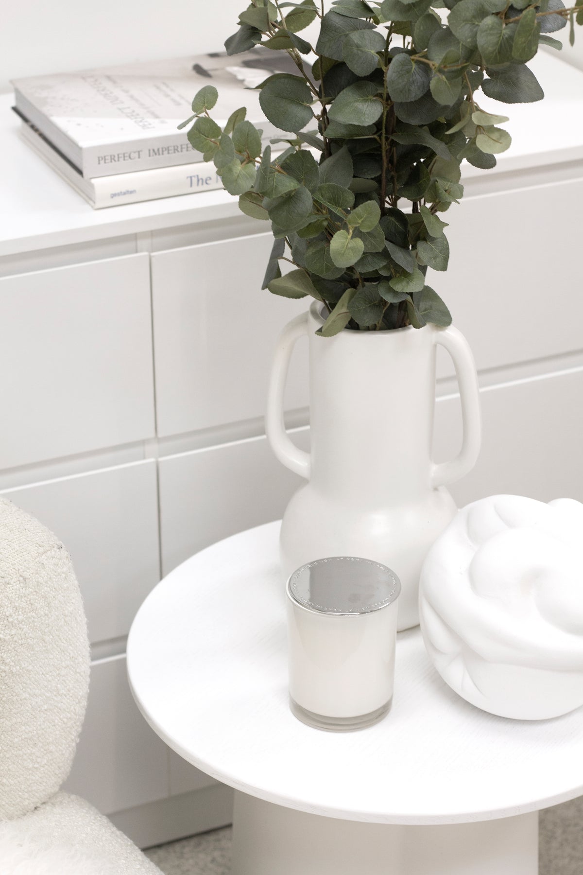 Strato Side Table styled with a lamp and books