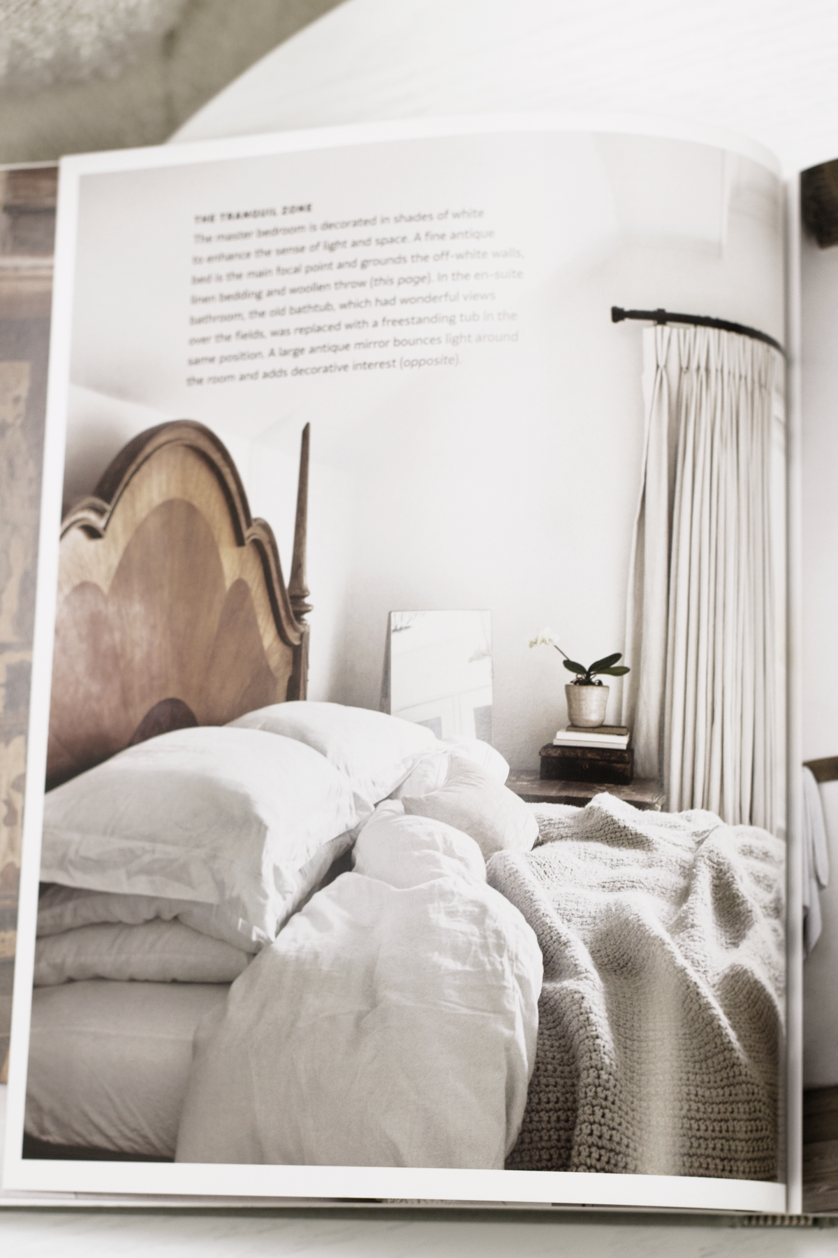 Calm interiors book styled on a console table