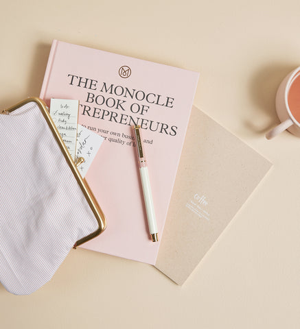 Metal Rollerball Pen in Petal styled on desk with notebook by Emma Kate Co