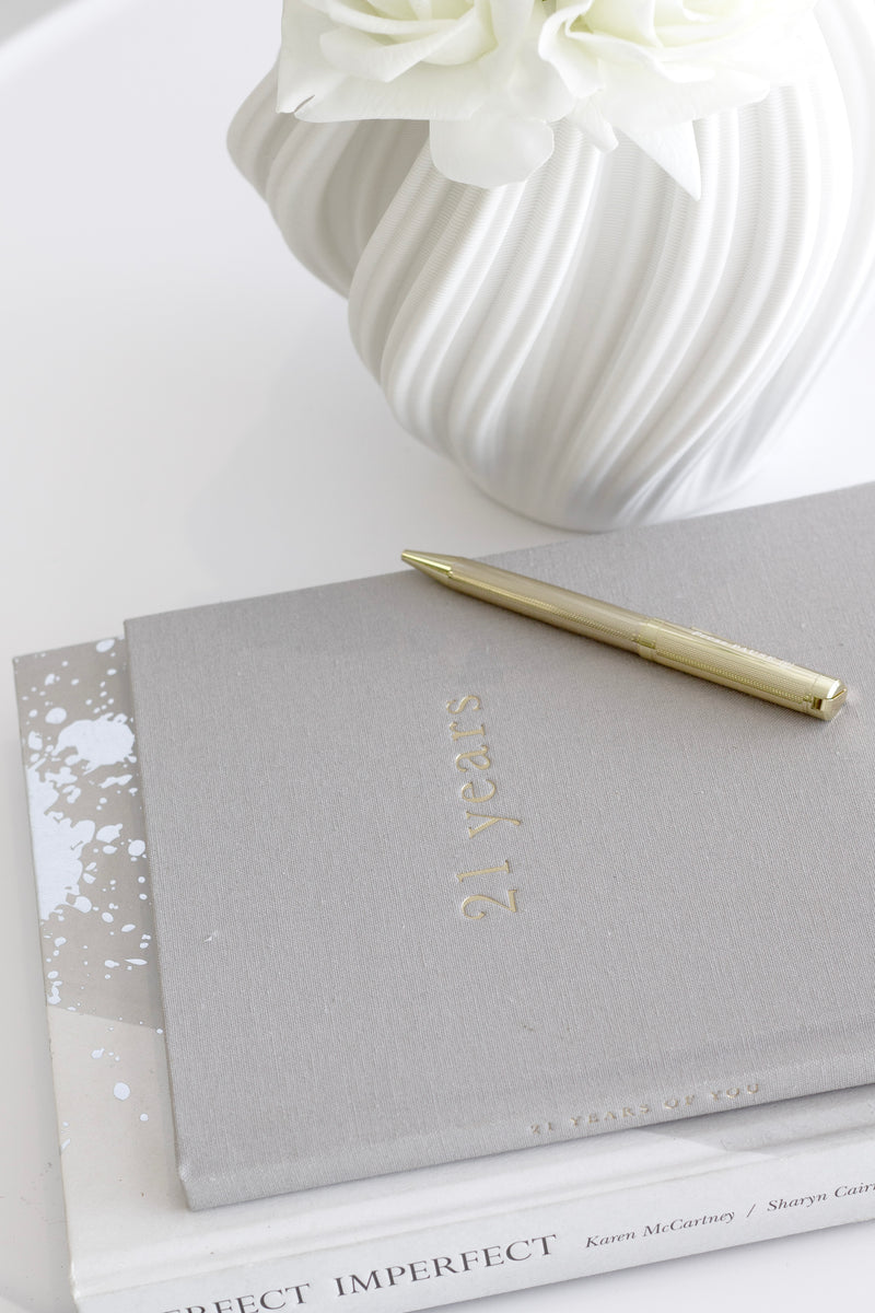 21 Years milestone keepsake book in grey linen with gold text; memory journal gift for birthdays and celebrations.
