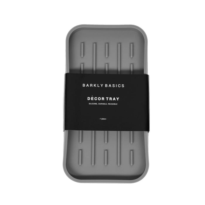 A Barkly Basics silicone decor tray with a black label on it, dishwasher safe.