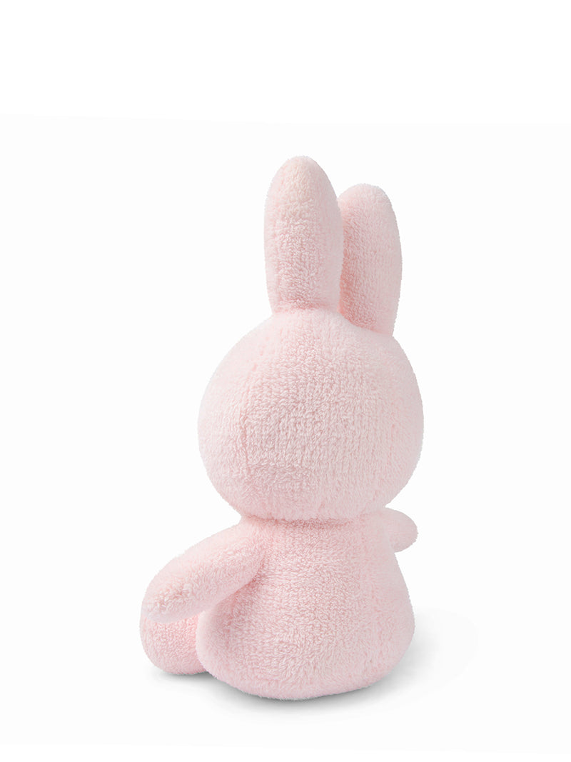 A officially licensed Mr Maria Miffy Sitting Terry Pink (33cm) plush sitting on a white surface.