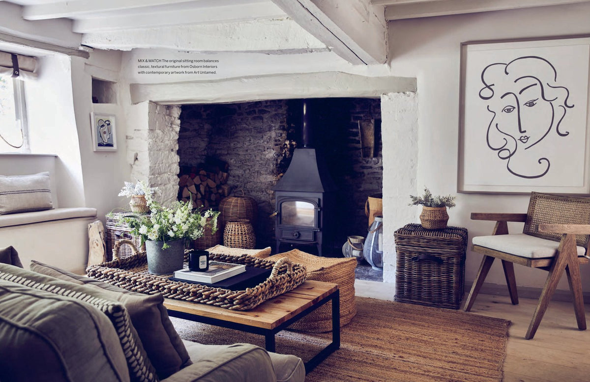 A living room with the book "CREATE: AT HOME WITH OLD & NEW" by Books.